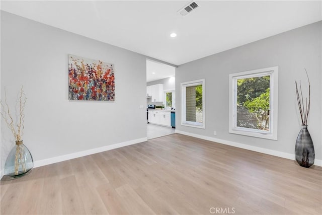 404 E Kingsley Ave, Pomona, CA 91767 - unfurnished living room featuring light wood-style floors, recessed lighting, and baseboards