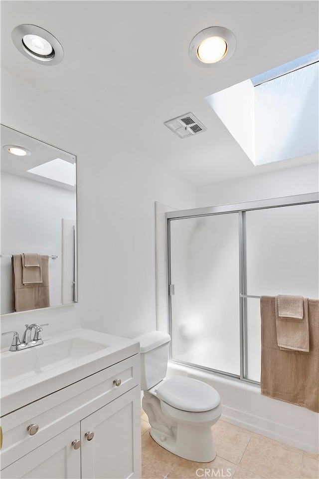 4312 Babcock Ave Unit 6, Studio City, CA 91604 - full bath with a skylight, toilet, vanity, bath / shower combo with glass door, and tile patterned floors