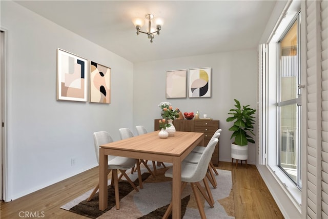 4312 Babcock Ave Unit 6, Studio City, CA 91604 - dining area featuring light wood-style flooring, a chandelier, and baseboards