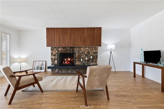 4312 Babcock Ave Unit 6, Studio City, CA 91604 - living area with light wood-type flooring, baseboards, and a fireplace