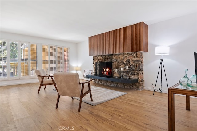 4312 Babcock Ave Unit 6, Studio City, CA 91604 - living room with a fireplace, light wood-style flooring, and baseboards