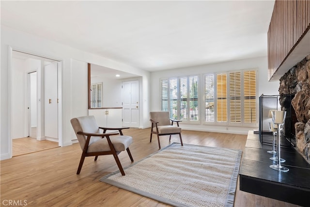 4312 Babcock Ave Unit 6, Studio City, CA 91604 - living area with a fireplace, light wood-style floors, and baseboards