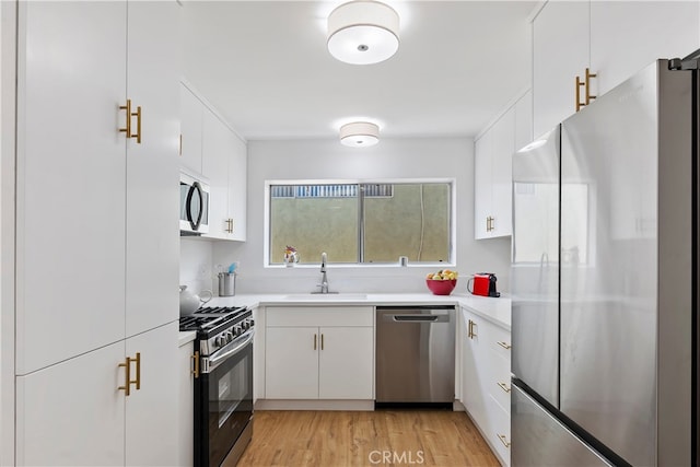 4312 Babcock Ave Unit 6, Studio City, CA 91604 - kitchen featuring appliances with stainless steel finishes, a sink, light countertops, and white cabinetry