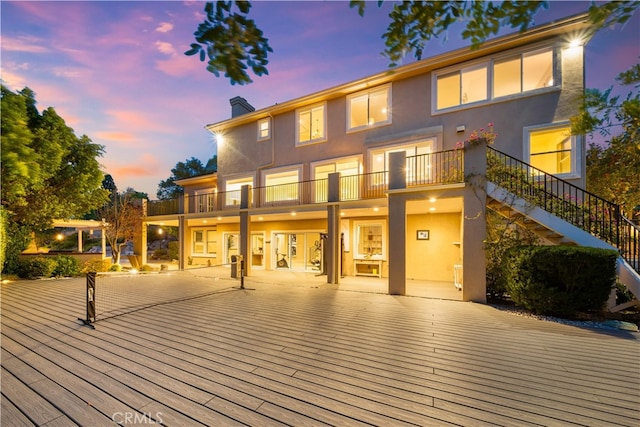 3048 Street Of The Chimes, Chino Hills, CA 91709 - back of house featuring stucco siding, a balcony, a chimney, and stairway