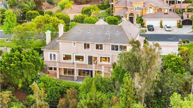 3048 Street Of The Chimes, Chino Hills, CA 91709 - back of house with a chimney and stucco siding