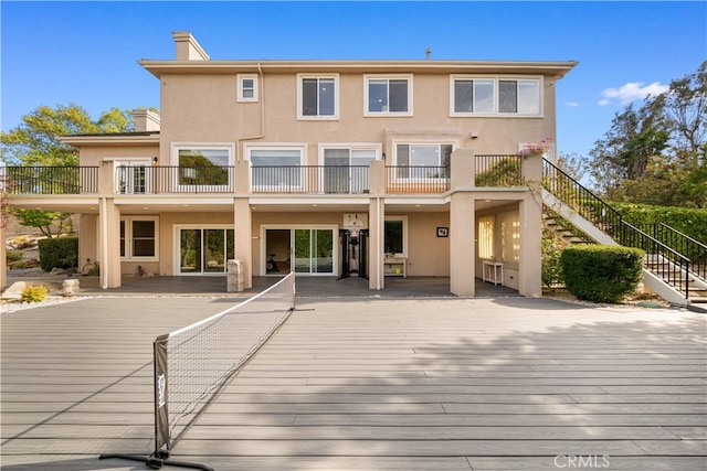 3048 Street Of The Chimes, Chino Hills, CA 91709 - back of property featuring stucco siding, stairway, and a wooden deck