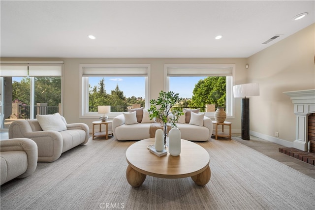 3048 Street Of The Chimes, Chino Hills, CA 91709 - living room with healthy amount of natural light, recessed lighting, and a fireplace with raised hearth