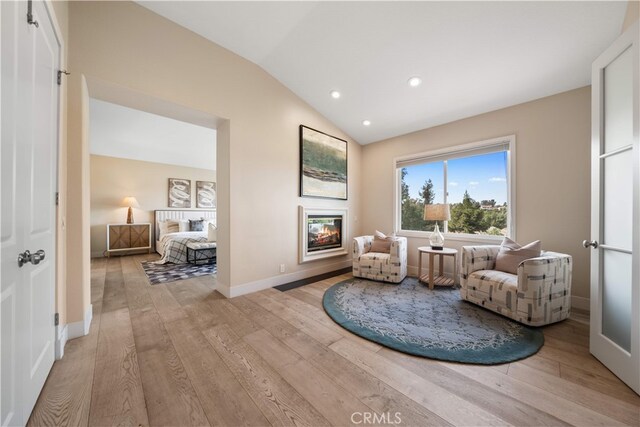 3048 Street Of The Chimes, Chino Hills, CA 91709 - living area with a glass covered fireplace, lofted ceiling, light wood-type flooring, and recessed lighting