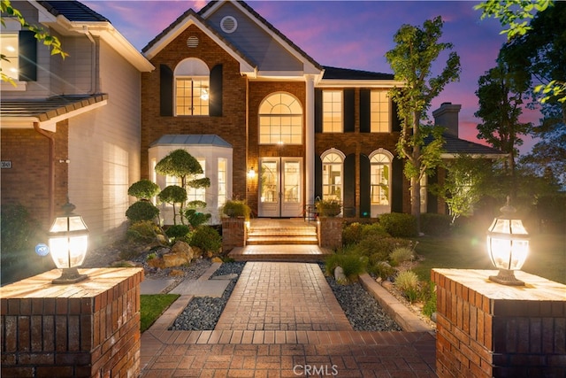 3048 Street Of The Chimes, Chino Hills, CA 91709 - view of front facade featuring french doors, brick siding, and a porch