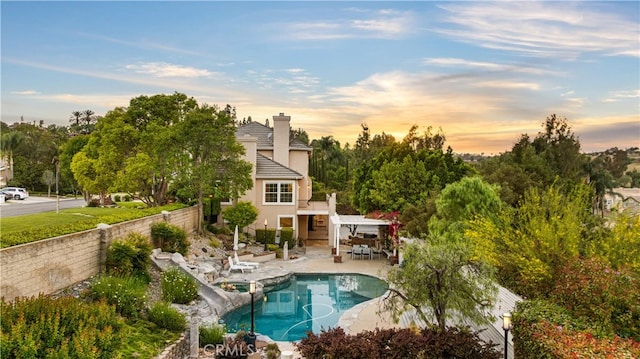 3048 Street Of The Chimes, Chino Hills, CA 91709 - back of property featuring a fenced backyard, a chimney, a patio area, and stucco siding