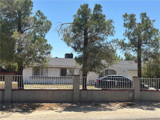 14199 Havasu Rd, Apple Valley, CA 92307 - rear view of property with a fenced front yard and stucco siding