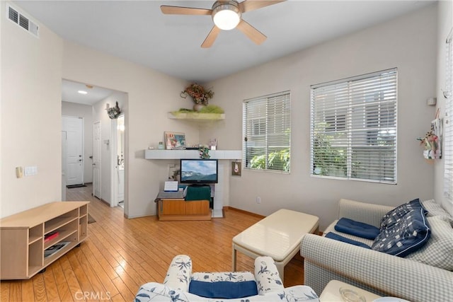 1972 W Blue Violet Ct, Anaheim, CA 92801 - living area with ceiling fan, light wood-style floors, and baseboards