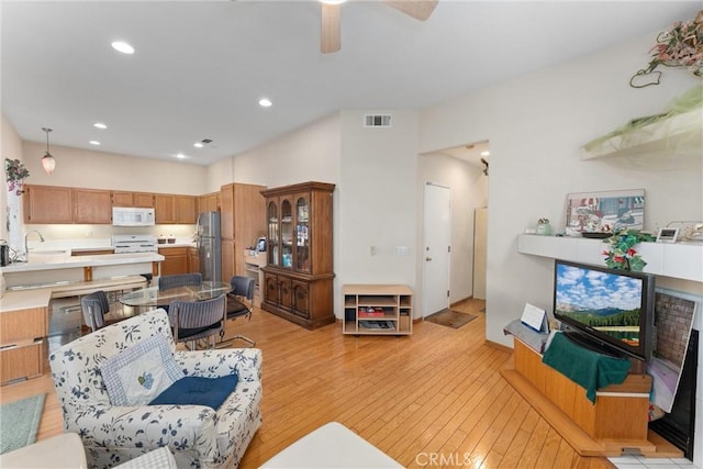 1972 W Blue Violet Ct, Anaheim, CA 92801 - living area featuring light wood-style flooring, ceiling fan, and recessed lighting