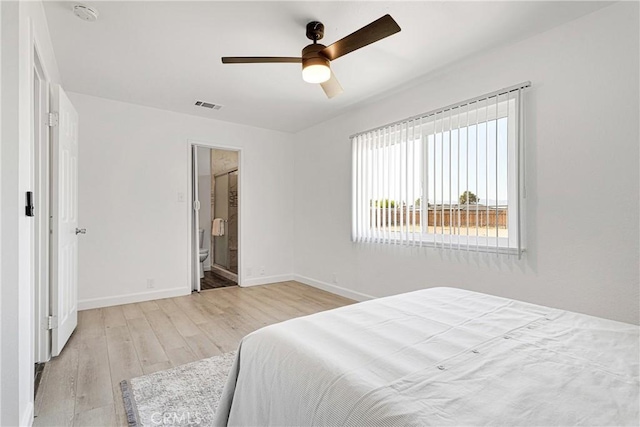 22331 Ramona Ave, Apple Valley, CA 92307 - bedroom featuring light wood finished floors, baseboards, connected bathroom, and ceiling fan
