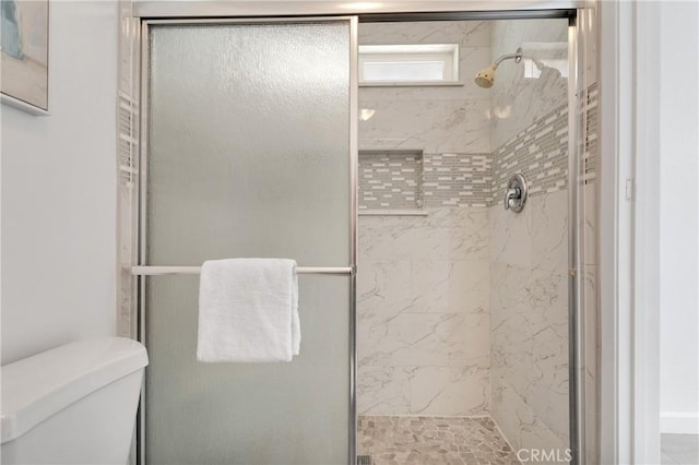 22331 Ramona Ave, Apple Valley, CA 92307 - full bathroom featuring a shower stall and toilet