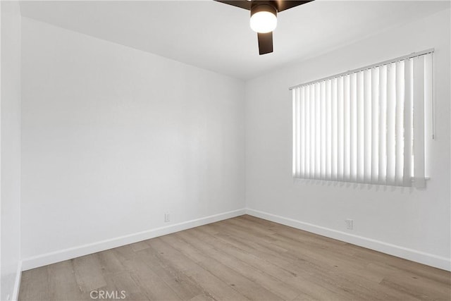 22331 Ramona Ave, Apple Valley, CA 92307 - unfurnished room with baseboards, wood finished floors, and a ceiling fan