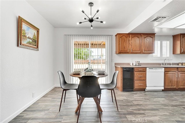 22331 Ramona Ave, Apple Valley, CA 92307 - dining area with a chandelier, wood finished floors, and baseboards