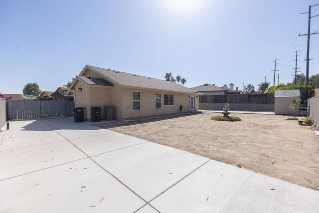 42117 Agena St, Temecula, CA 92592 - back of property with a patio area and stucco siding
