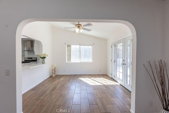 42117 Agena St, Temecula, CA 92592 - spare room with vaulted ceiling, a ceiling fan, wood finished floors, arched walkways, and french doors