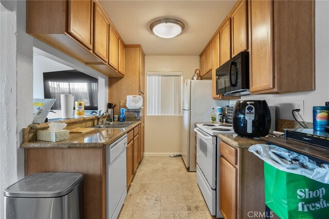 1105 Sepulveda Blvd # C101, Torrance, CA 90502 - kitchen featuring white appliances, a sink, brown cabinets, and dark stone counters