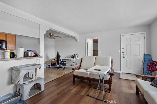 1105 Sepulveda Blvd # C101, Torrance, CA 90502 - living area featuring a desk, a ceiling fan, and dark wood-style floors
