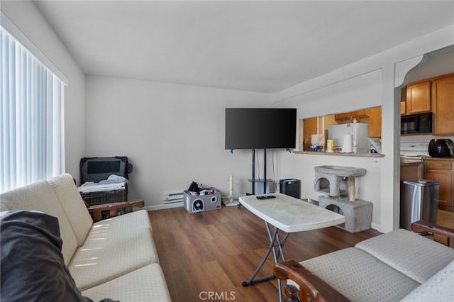 1105 Sepulveda Blvd # C101, Torrance, CA 90502 - living area with wood finished floors and a baseboard radiator