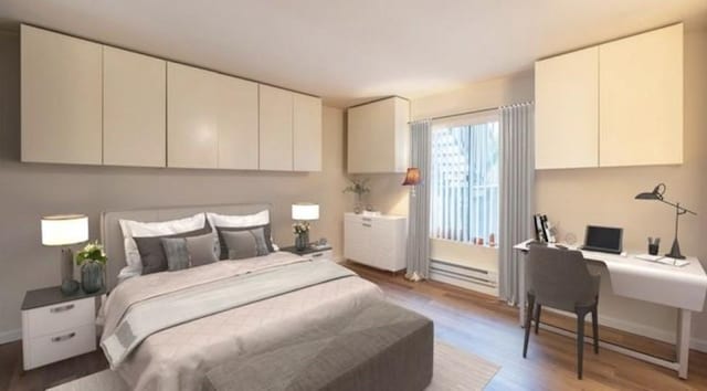 1105 Sepulveda Blvd # C101, Torrance, CA 90502 - bedroom featuring light wood-style flooring, a baseboard heating unit, an office area, and baseboards