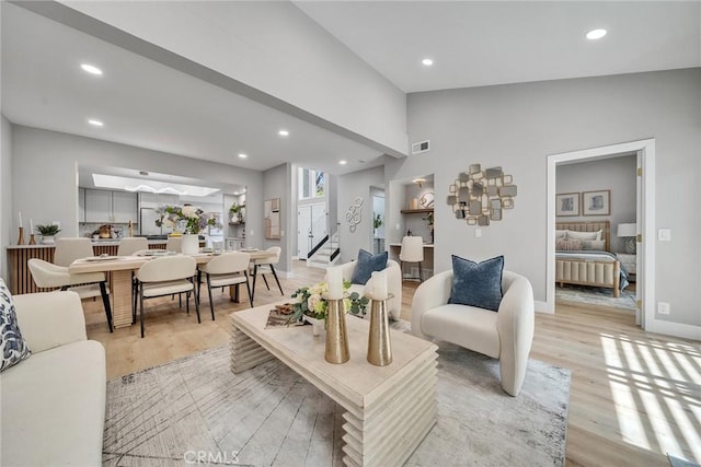 10 Lassen, Irvine, CA 92612 - living room with light wood finished floors, radiator, recessed lighting, lofted ceiling, and baseboards