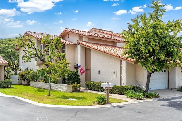 10 Lassen, Irvine, CA 92612 - mediterranean / spanish-style house featuring a tile roof, stucco siding, a front yard, a garage, and concrete driveway