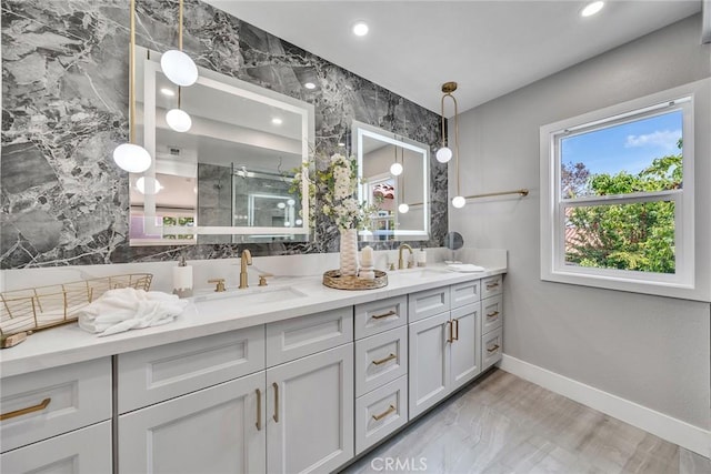 10 Lassen, Irvine, CA 92612 - bathroom with double vanity, a shower stall, baseboards, and recessed lighting