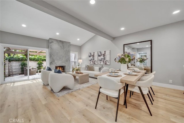 10 Lassen, Irvine, CA 92612 - living area with lofted ceiling, light wood finished floors, a fireplace, recessed lighting, and baseboards
