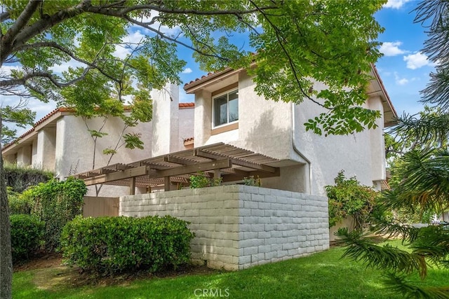 10 Lassen, Irvine, CA 92612 - view of property exterior with stucco siding and a pergola