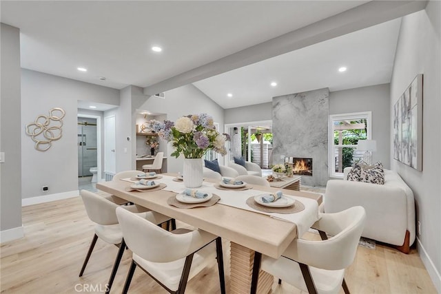 10 Lassen, Irvine, CA 92612 - dining area with light wood-type flooring, baseboards, a premium fireplace, recessed lighting, and lofted ceiling