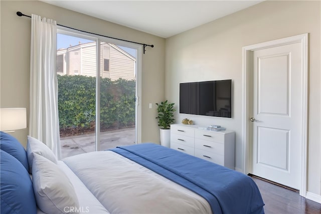 20267 Estuary Ln, Newport Beach, CA 92660 - bedroom with access to outside and dark wood-type flooring