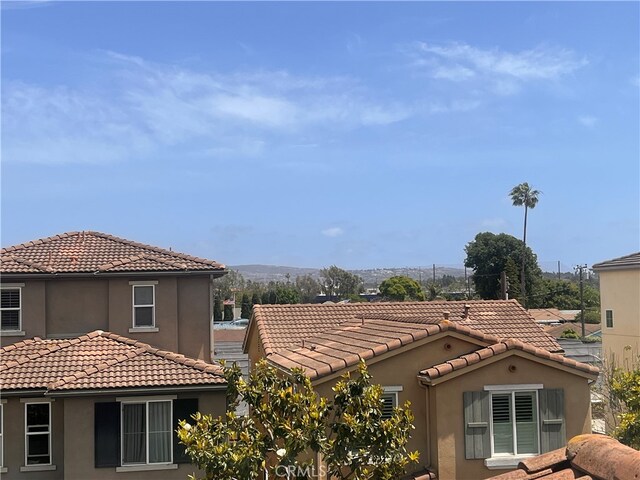 20267 Estuary Ln, Newport Beach, CA 92660 - exterior view of stucco siding and a tiled roof