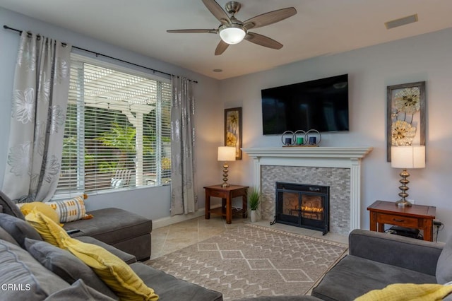 904 Calle Higuera, Camarillo, CA 93010 - living room featuring a ceiling fan, a glass covered fireplace, baseboards, and tile patterned floors