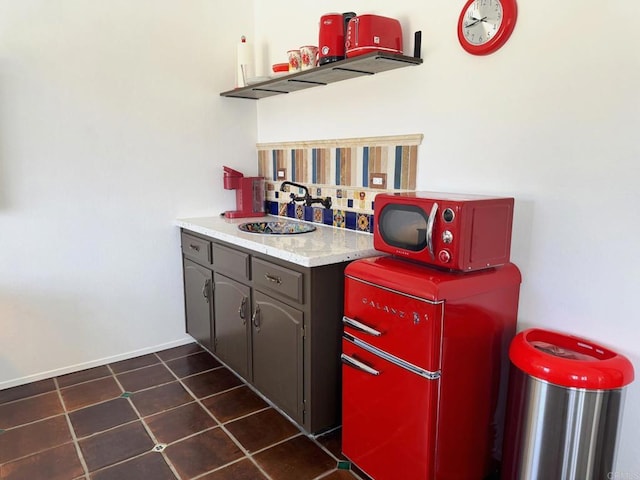 1650 Winterwarm Dr, Fallbrook, CA 92028 - kitchen featuring a sink, light countertops, and baseboards
