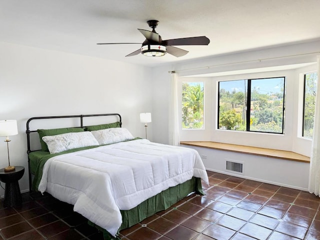 1650 Winterwarm Dr, Fallbrook, CA 92028 - tiled bedroom with multiple windows, a ceiling fan, and baseboards