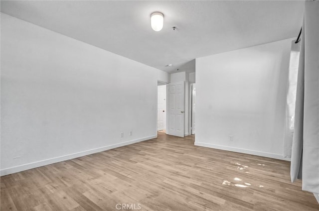 700 W 3rd St Unit A117, Santa Ana, CA 92701 - empty room featuring light wood-style flooring and baseboards