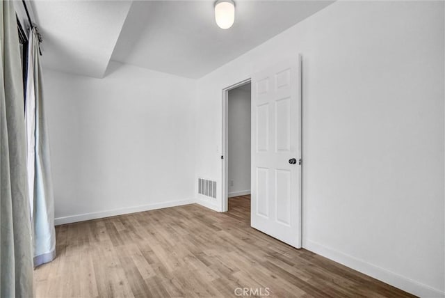 700 W 3rd St Unit A117, Santa Ana, CA 92701 - unfurnished room featuring wood finished floors and baseboards