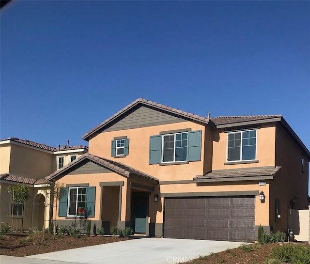 4706 Vanderham Way, Eastvale, CA 91752 - view of front facade featuring a garage, a tile roof, concrete driveway, and stucco siding