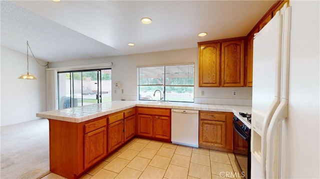 205 Cedar Heights Dr, Thousand Oaks, CA 91360 - kitchen featuring white appliances, a sink, brown cabinets, a peninsula, and recessed lighting