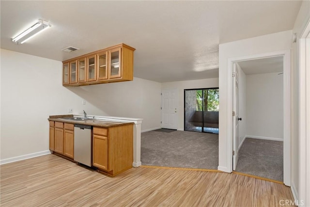 1114 Nord Ave Unit 36, Chico, CA 95926 - kitchen with dishwasher, baseboards, and brown cabinets