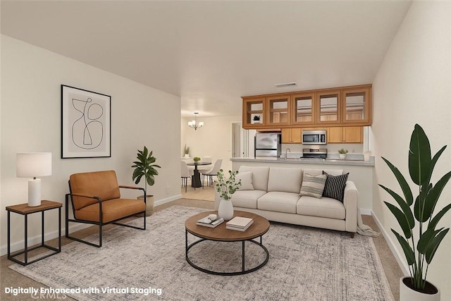 1114 Nord Ave Unit 36, Chico, CA 95926 - carpeted living area with baseboards, a sink, and a chandelier