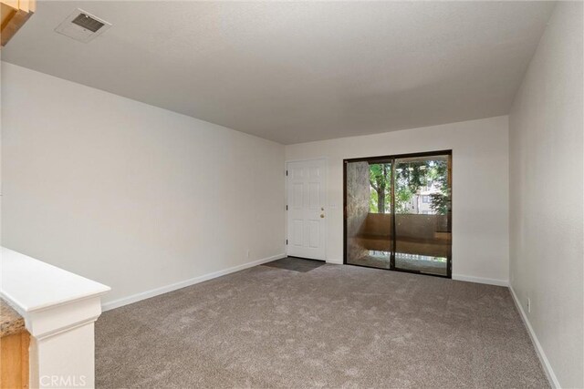 1114 Nord Ave Unit 36, Chico, CA 95926 - carpeted empty room featuring baseboards