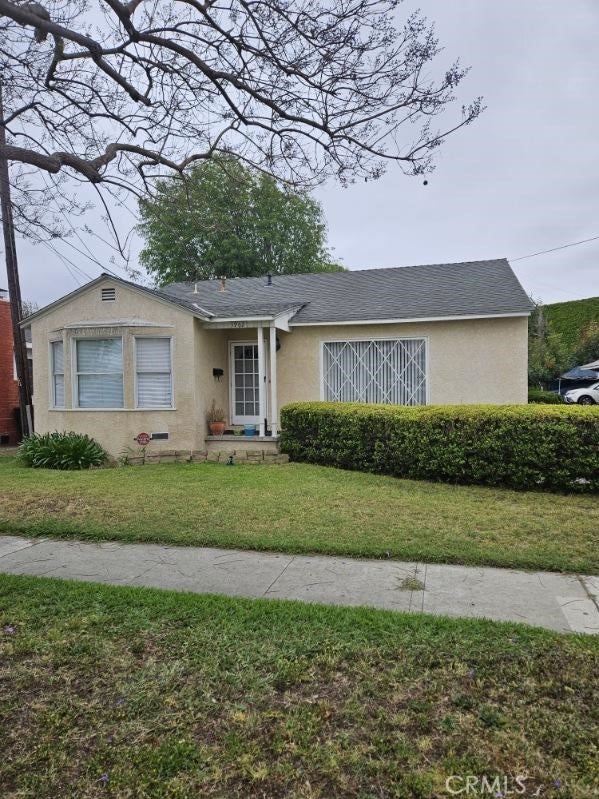 3960 W 171st St, Torrance, CA 90504 - view of front of house with stucco siding, a front lawn, and a shingled roof