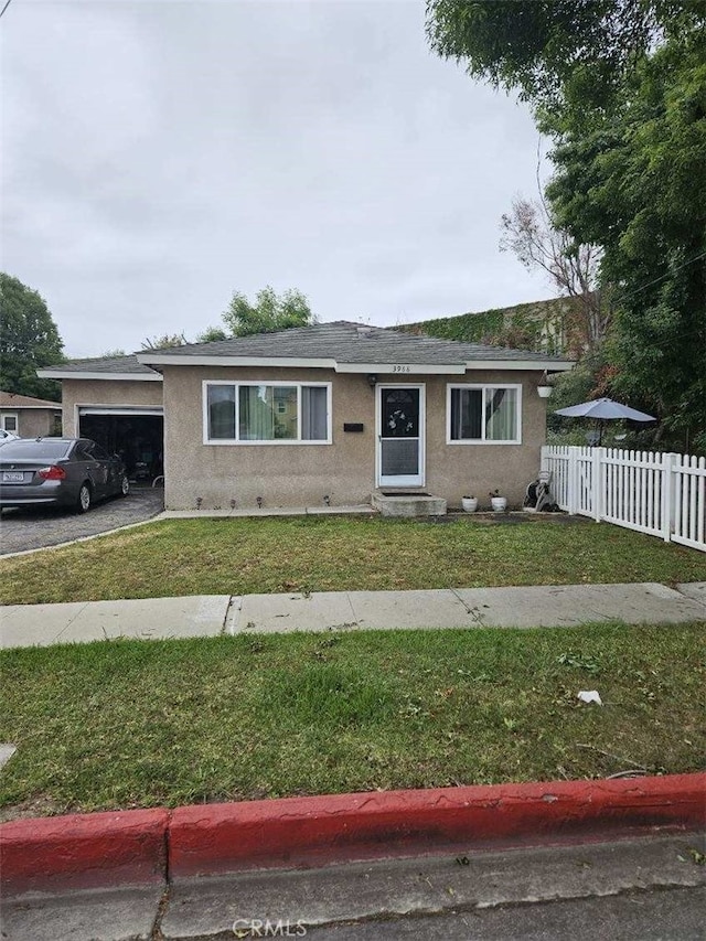 3960 W 171st St, Torrance, CA 90504 - view of front facade with stucco siding, a garage, and roof with shingles