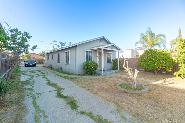 151 E 105th St, Los Angeles, CA 90003 - view of front facade featuring stucco siding and concrete driveway