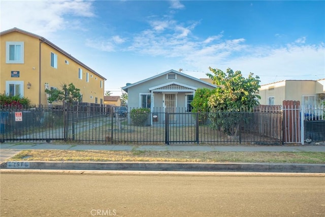 151 E 105th St, Los Angeles, CA 90003 - view of front of house featuring stucco siding and a fenced front yard