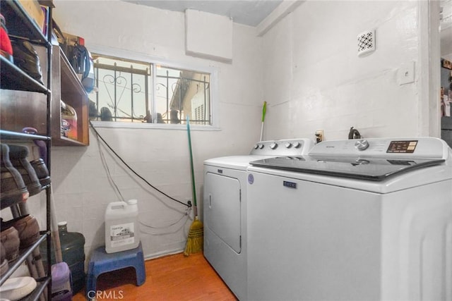 151 E 105th St, Los Angeles, CA 90003 - laundry area with washing machine and clothes dryer and light wood-type flooring